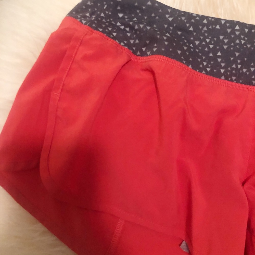 Neon pink and grey Nike shorts